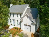 Charming two-story home with landscaped yard and attached garage at 1222 Dixie Trl, Raleigh, NC 27607