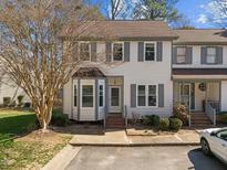 Charming townhome featuring neutral siding, gray shutters, and a delightful bay window at 12 Citation Dr, Durham, NC 27713