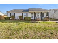 Charming one-story home featuring a well-maintained lawn, welcoming porch, and classic curb appeal at 4 Hannah Ct, Durham, NC 27713