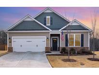 Charming single-Gathering home with a two-car garage and well-manicured front yard, complemented by a welcoming entrance at 10 Parker Pond Ct, Durham, NC 27703