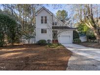 Charming two-story home with a manicured front yard and attached garage at 111 Legacy Ln, Durham, NC 27713
