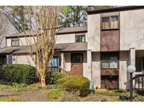 Charming condo with landscaped front yard and blue front door at 3775 Guess Rd # 36, Durham, NC 27705