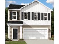 Charming two-story home featuring black shutters, a two-car garage, and a welcoming front entrance at 103 Gabriel Ct, Clayton, NC 27520