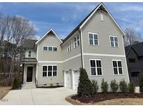 Beautiful two-story home with a well-manicured lawn and a two-car garage at 12912 Grey Willow Dr, Raleigh, NC 27613