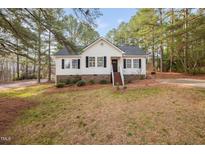 Charming single-Gathering home featuring a welcoming entrance and beautiful landscaping at 166 Hammerstone Dr, Fuquay Varina, NC 27526