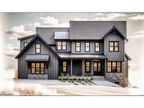 Charming two-story home with board and batten siding, stone accents, and a welcoming front porch at 422 Lower Thrift Rd, New Hill, NC 27562