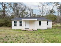 Charming single-story home with light siding and a covered front porch at 501 N 14Th St, Erwin, NC 28339