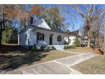Charming two-story home featuring a welcoming front porch and well-manicured landscaping at 704 Pender St, Rocky Mount, NC 27801