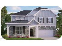 Charming two-story home with gray siding, black shutters and a covered front porch at 7569 Percussion Dr, Apex, NC 27539