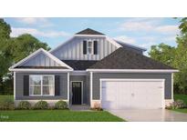 Charming single-Gathering home with a two-car garage, lush lawn and neutral-tone siding at 7573 Percussion Dr, Apex, NC 27539