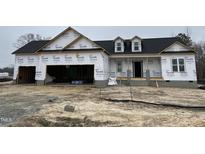 New home construction featuring a 2-car garage and dormer windows at 880 Olive Branch Dr, Smithfield, NC 27577