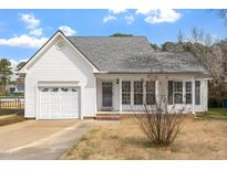 Charming single-Gathering home with a well-maintained yard and an attached one-car garage at 7201 Spanglers Spring Way, Raleigh, NC 27610