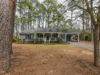 Charming single-story home featuring a covered front porch and well-maintained landscaping at 314 Mill Creek Dr, Fuquay Varina, NC 27526
