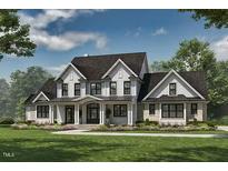 Stunning two-story modern farmhouse with stylish black-framed windows and a beautifully landscaped lawn and garden at 4030 Granite Ridge Trl, Raleigh, NC 27616