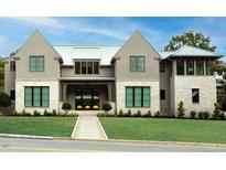 Stunning home with a manicured lawn, stone accents, and a metal roof under a bright blue sky at 4300 Camelot Dr, Raleigh, NC 27609