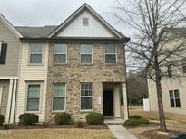 Charming two-story home with a brick and vinyl exterior and manicured landscaping at 4469 Middletown Dr, Wake Forest, NC 27587