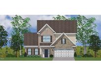 Two-story home featuring a two car garage, brick and stone facade, shutters, and a shingled roof at 2726 Lacy Holt Rd, Graham, NC 27253