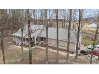 Charming home with a cozy front porch, set among mature trees at 3405 Wilsons Mills Rd, Smithfield, NC 27577