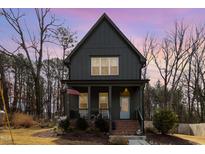 Charming two-story home with inviting front porch and American flag displayed at 727A Peyton Ave, Durham, NC 27703