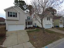 Charming two-story home with a one car garage, inviting front porch and well-maintained lawn at 821 Brookhannah Ct, Fuquay Varina, NC 27526