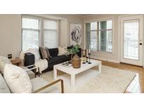 Cozy living room featuring neutral colors, lots of natural light, and an inviting seating area at 1210 Westview Ln # 201, Raleigh, NC 27605