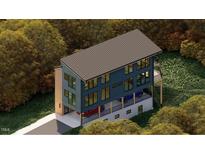 Modern home featuring a unique cantilevered design, a flat roof, large windows, and an attached garage at 1709 Evergreen Ave, Raleigh, NC 27603