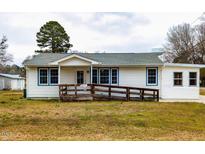 Charming single-story home with a ramp, offering easy access and curb appeal at 200 Pace St, Smithfield, NC 27577