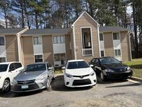 Charming townhouse featuring neutral siding, white trim, and private entrance in a well-maintained neighborhood at 322 Junction Rd # 17D, Durham, NC 27703