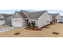 Inviting single-Gathering home with a manicured front yard and attached two-car garage at 629 Kenyon Spring Dr, Zebulon, NC 27597