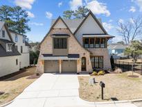 Beautiful two-story home with a brick facade and a three-car garage in a desirable neighborhood at 3727 Bellevue Rd, Raleigh, NC 27609