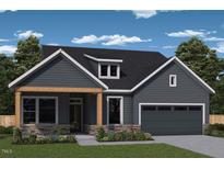 Charming one-story home with stone accents, wood porch supports, and a lovely landscaped front yard at 122 Wabash St, Pittsboro, NC 27312