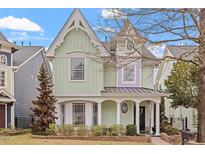 Charming Victorian-style home with unique architectural details and a well-maintained front yard at 1701 Legendary Ln, Morrisville, NC 27560