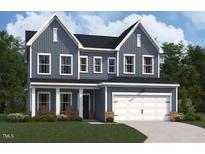 Charming two-story home boasts a two-car garage and professionally landscaped front yard at 229 S Harvest Ridge Way # Homesite 208, Clayton, NC 27520