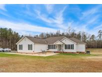 Charming single-story home featuring a well-maintained lawn and inviting facade at 2650 Spring Hill Rd, Spring Hope, NC 27882