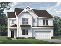 Beautiful white two-story home with a covered entrance and a two-car garage at 33 White Azalea Way, Homesite 80, Benson, NC 27504