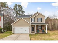 Charming two-story home with a welcoming front porch and well-maintained landscaping at 4342 Bay Rum Ln, Raleigh, NC 27610