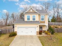 Charming two-story home with a two car garage and a well-manicured front yard at 5315 Glenmorgan Ln, Raleigh, NC 27616