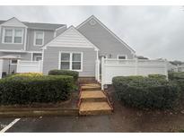 Charming townhome with manicured landscaping, neutral siding, and a welcoming entryway at 5054 Avenida Del Sol Dr, Raleigh, NC 27616