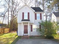 Charming two-story home with gray siding and dark red shutters at 1313 Swingline Way, Raleigh, NC 27610