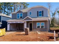 New two-story home featuring a two-car garage, gray siding, and covered porch at 157 Klamath Dr, Garner, NC 27529
