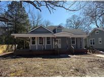 Charming single-Gathering home features a cozy covered porch and traditional architectural details at 425 S Mercer St, Rocky Mount, NC 27801