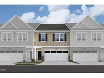 Charming townhome featuring a private garage and a welcoming front entrance at 6964 Doddridge Ln # 13, Cary, NC 27519