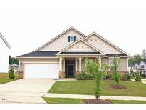 Charming single-Gathering home with a well-maintained lawn and attached two-car garage at 117 Oak Rise Ln, Fuquay Varina, NC 27526