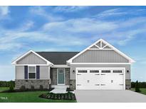 Charming home featuring stone accents, vertical siding, two-car garage, and manicured lawn at 14 Artesa Ct, Fuquay Varina, NC 27526