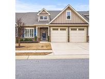 Charming two-story home featuring a two-car garage and manicured front yard, perfect for suburban living at 255 Thornwhistle Pl, Garner, NC 27529