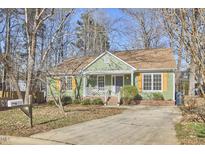 Charming green home with a well-maintained yard and inviting curb appeal at 5 Radley Pl, Durham, NC 27705