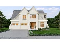 Inviting two-story home featuring a symmetrical facade, multi-car garage, and manicured landscaping at 525 Peebles St, Raleigh, NC 27608