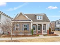 Charming one-story home with a cozy front porch and well-maintained landscaping at 5341 Forsyth Park St, Raleigh, NC 27616