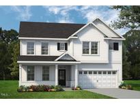 Charming two-story home featuring classic white siding, black shutters, and a well-manicured front lawn at 8733 Maxine St # 37, Willow Springs, NC 27592