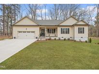 Charming single-story home with a well-manicured lawn and inviting front porch at 105 Oak Ridge Rd, Franklinton, NC 27525